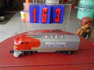 0 gauge lionel santa fe locomotive with battery op horn very heavy. As shown.