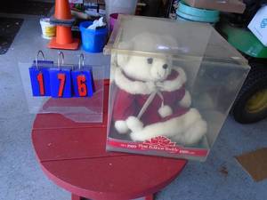 Christmas bear in plastic case. As shown.
