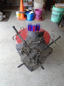 Metal shield with swords wall hanger. As shown.