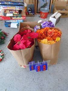 Group of artifical flowers. As shown.