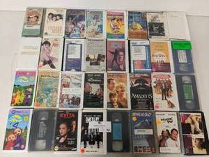 lot 164 image: 32 Assorted VHS Tapes-Untamed Heart,Roxy Carmichael,The Terminator, The Inkwell, Amadeus,Pay It Forward ,Driving Me Crazy, Men In Black II, Teletubbies, Evita, Pets on Parade ,Fathers Day,  And More