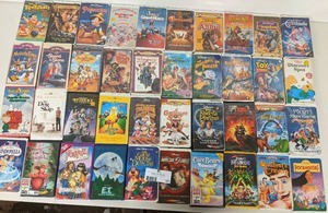 lot 163 image: 40 Assorted VHS Tapes-  Pinochio, Cinderella, ET,Beetlejuice ,Peter Pan,A Christmas Story ,Spy Kids II ,Toy Story, The Brave Little Toaster,Pocahontas, My Favorite Martian, Annie  A Christmas Story, Scooby-Doo ,The Land Before Time  And More