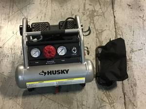 lot 49 image: Husky 1 Gal. Portable Electric-Powered Silent Air Compressor &nbspCustomer Returns See Pictures