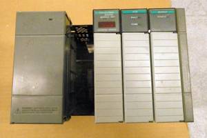 lot 25 image: Allen Bradley SLC500 4 slot rack with Power Supply, DeviceNet, Output and DCM modules