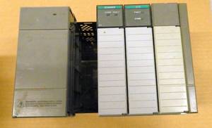 lot 26 image: Allen Bradley SLC500 4 slot rack with Power Supply, Scanner and DCM modules