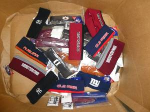 lot 58 image: 22 athletic headbands with various teams and 11 winter headbands