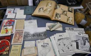 lot 188 image: Large group of vintage paper, advertising, scrapbook full of graduation pictures, etc