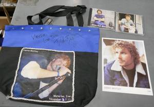 lot 197 image: Dierks Bentley Fans - autographed bag, photo and music CDs
