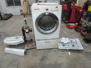 lot 121 image: Pedestal Sink, Gas Cooktop, Vacuum, Washer (washer needs work)