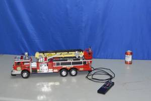 lot 18 image: 1988 Rescue Boom Fire Engine Truck No. 55 Wired Remote Control Operated