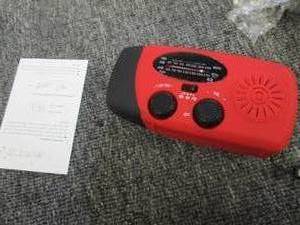 solar radio with flashlight turns o...