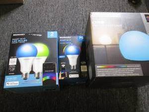 3 smart LED bulbs and a portable LE...