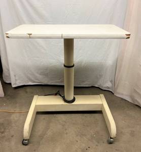 MSRP $2000 Humphrey D120 Double Power Height Adjustment Medical Work Table&nbspAdjustable from 28 inches to 40 Inches Tall&nbsp- Good Working Condition - Has Surface Stains On Top &amp Chipping of Laminate On Side - See Pictures