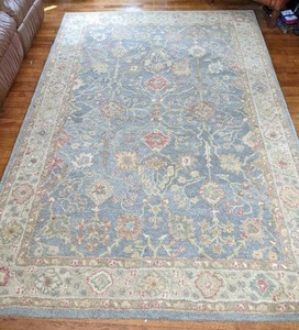 lot 62 image: Safavieh Antiquity Collection Handmade Traditional Oriental Premium Wool 9 x 6 Area Rug in Blue Ivory