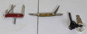 lot 100 image: Collection of (2) PocketSwiss Army Knives and Flint Lock