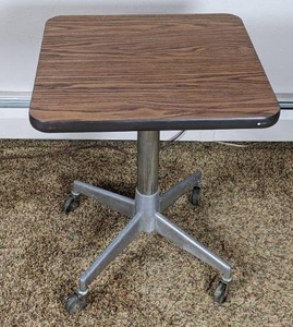 lot 36 image: Square Pedestal Base Table on Wheels