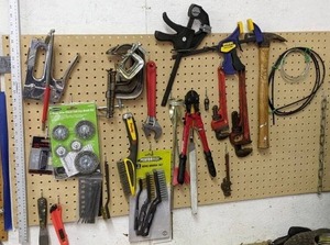 lot 31 image: Wonderful Wall of Tools (pt. 2) Stapler, Clamps, Hammer, Wire Brushes, Bolt Cutters and More
