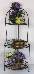 lot 75 image: Three Tier Wrought Iron Corner Shelf with Artificial Floral Arrangements