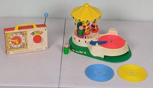 lot 54 image: Vintage Toys 1964 Fisher Price Music Box Toy & 1980 Change A Tune Carousel Merry Go Round