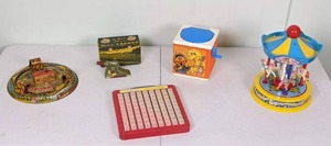 lot 159 image: Lot of 5 Vintage Toys Marx Train Toy, Math Toy, Howie Cannon, Sesame Street Jack in the Box and Redbox Carousel