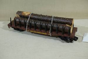 lot 176 image: Lionel O Gauge Lumber Company Train Car with Logs