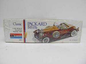 lot 63 image: Vintage Monogram Packard Boat Tail Speedster