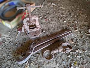 lot 93 image: Antique Pipe Vise, Well Pipe Puller and Large Wrench