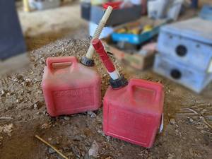 lot 108 image: Pair of Plastic Gas Cans - 1 and 2 Gallon - One is old Style w Vent on Back