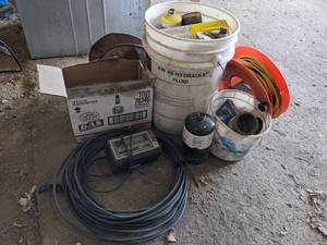 lot 126 image: (6) Bottle of STP Gas Treatment, Empty Propane Cylinders, Wire, Extension Cord and More