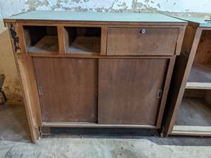 lot 336 image: Solid Wood Teller Station from Former Bank Building with 1 Drawer and Sliding Doors - This is Located in the Basement, Bring Help to Remove