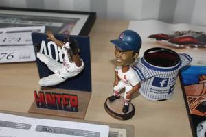 lot 177 image: Lot of (3) Baseball Collectibles - Hunter Twins Outfield Save, Lou Brock St. Louis Cardinals Baseball Bobblehead, Fox Sports North Girls Baseball Pencil Holder