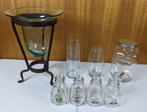 Assortment of Glass Items Vase, Bottles, Drink Dispenser, and More