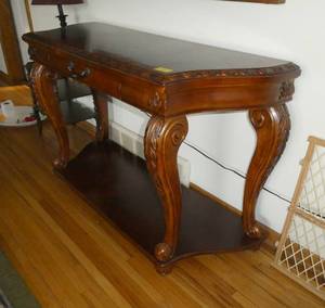 lot 1 image: A very nice side table measuring 52x19x33 tall, no noted damage