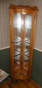 lot 7 image: Nice corner curio cabinet measuring 59 tall, 13 radius, 3 glass shelves