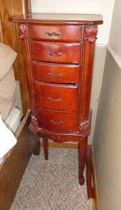 lot 46 image: Jewelry cabinet - needs leg put back on - measures 11x13x36