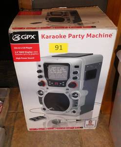 lot 91 image: Karaoke machine and cds