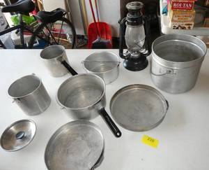 lot 210 image: Camping cook pans, all set inside each other, and a lantern