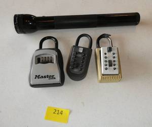 lot 214 image: 3 lock boxes and a Mag Lite