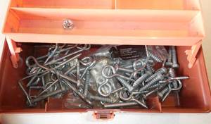 lot 228 image: tackle box with a bunch of eyebolts, screws, and misc tools