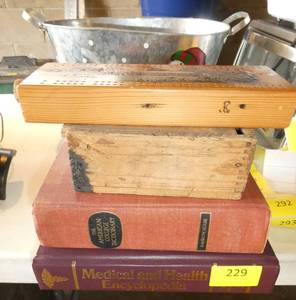 lot 229 image: Medical book, dictionary, vintage wood box, wood carved cribbage board and a snowman bucket