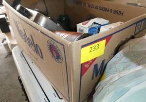 lot 233 image: Box lot of a new hot plate, disposable silverware, leather drink holder, vintage insulators, cast iron pan and 3 pictures