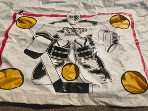 lot 260 image: Large hockey tarp you hang in front of your garage door for the kids to practice, measures 16 feet wide x 7 feet tall