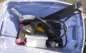 lot 309 image: Tote of misc items, outlet strip, t-fal pan, dust mask, heater