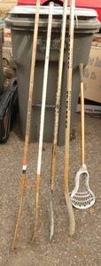 lot 317 image: Group of 4 hockey sticks and a lacrosse stick