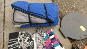 lot 325 image: Camping fishing adventure - sleeping bag plus a couple blankets, portable fishing rod, lantern, toilet cover for a 5 gallon pail and a grill brush