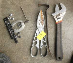 lot 336 image: Another tool lot with a large adjustable wrench, pry bar, flaring tool kit, snips