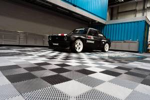 NEW IN THE BOX NEVER INSTALLED - MOTOR MAT 12 By 12 GARAGE FLOOR TILES - 74 BOXES - APPROX 1460 SQ FEET TOTAL - COLORS MAT WHITE, BLACK & GRAY - SEE PICTURES