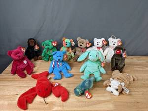 lot 100 image: Ty Beanie Baby Collection Pinchers the Lobster, Wrinkles the Bulldog, Hippity the Rabbit, Peace Bear, Cheeks the Baboon, and Many More - B