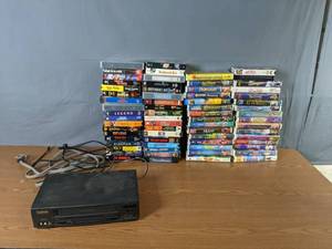 lot 330 image: Vintage Symphonic VCR and Collection of VHS Back to the Future, Ghost Busters 2, Ghost, Batman, Die Hard, Hercules, Mulan, Aladdin, Stuart Little and More - Q