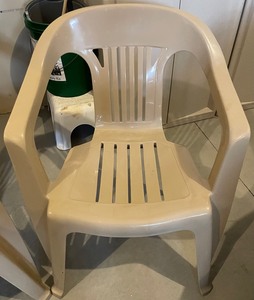 Two Plastic Patio Chairs